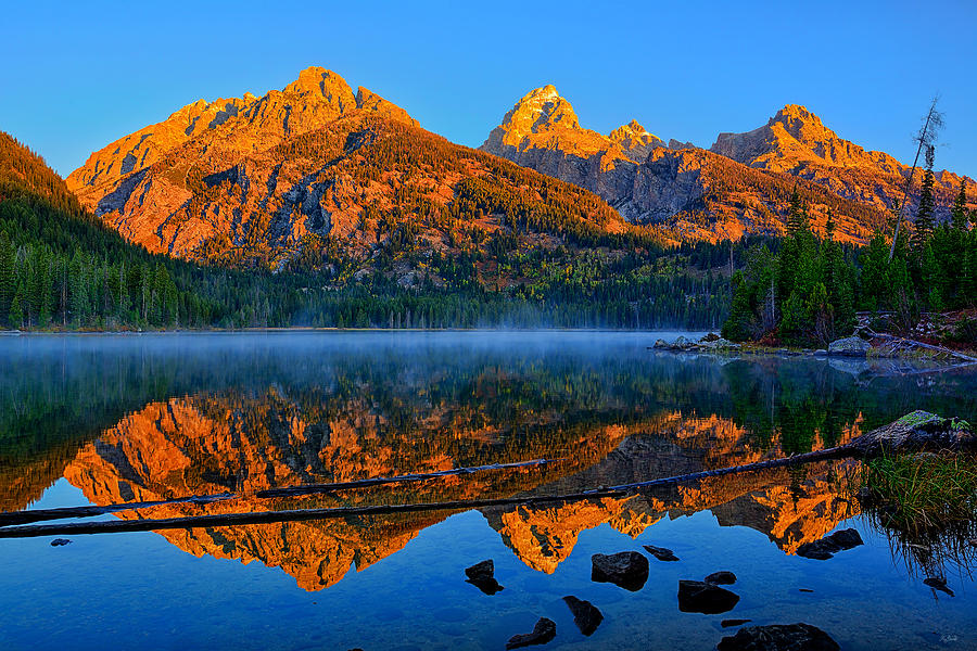 First light of the morning on the Tetons along Taggart Lake in Grand Teton National Park