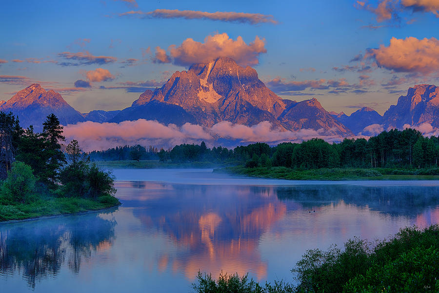 First light of the morning on Mt Moran and the Tetons at Oxbow Bend in Grand Teton National Park